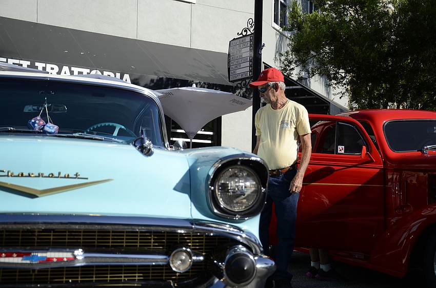 Ron Plank checks out the classic Chevy at Ed Tavern's car show.