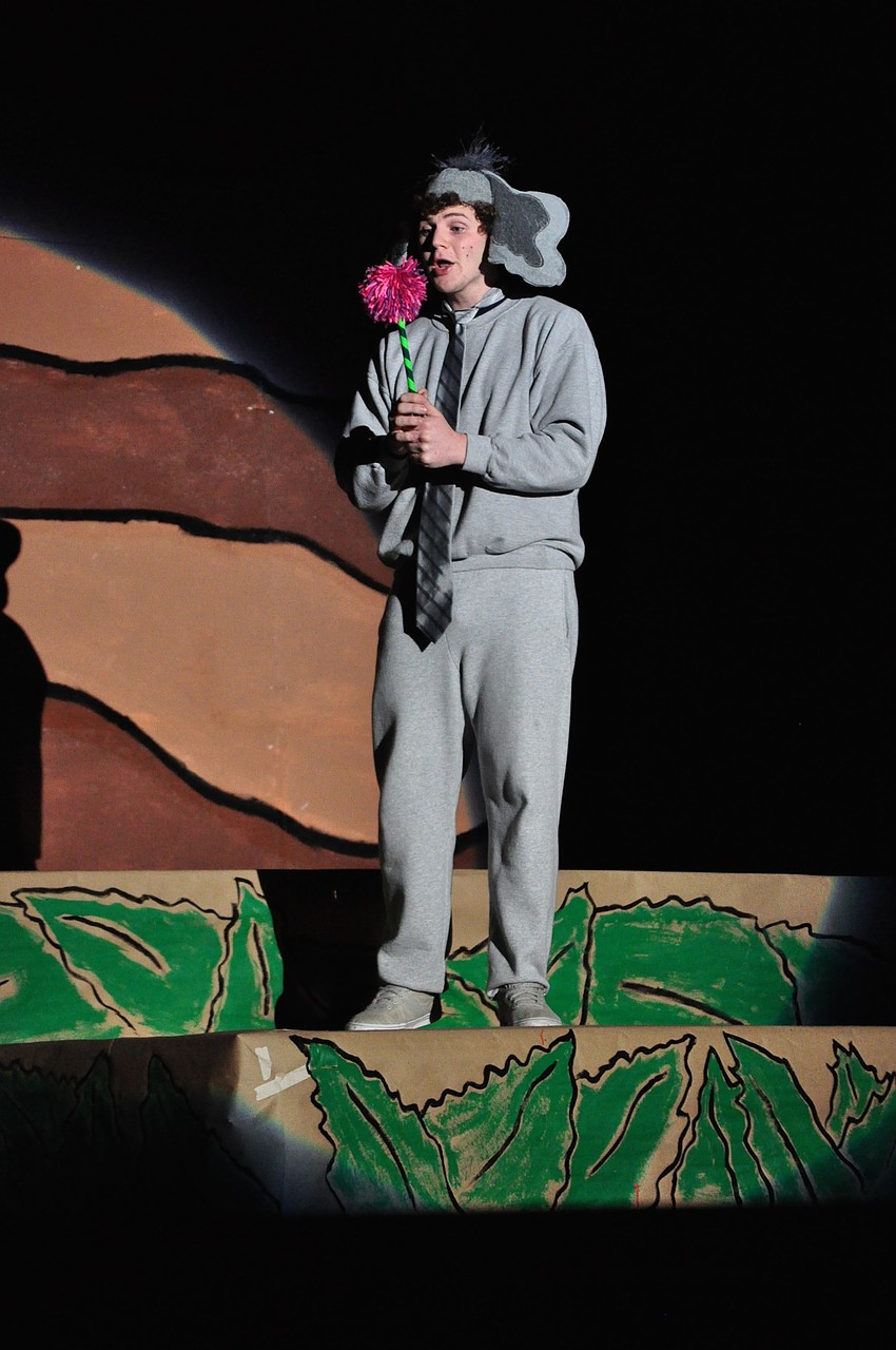 Horton, the elephant, played by senior John D’Amico, talks to a speck he put on a clover.