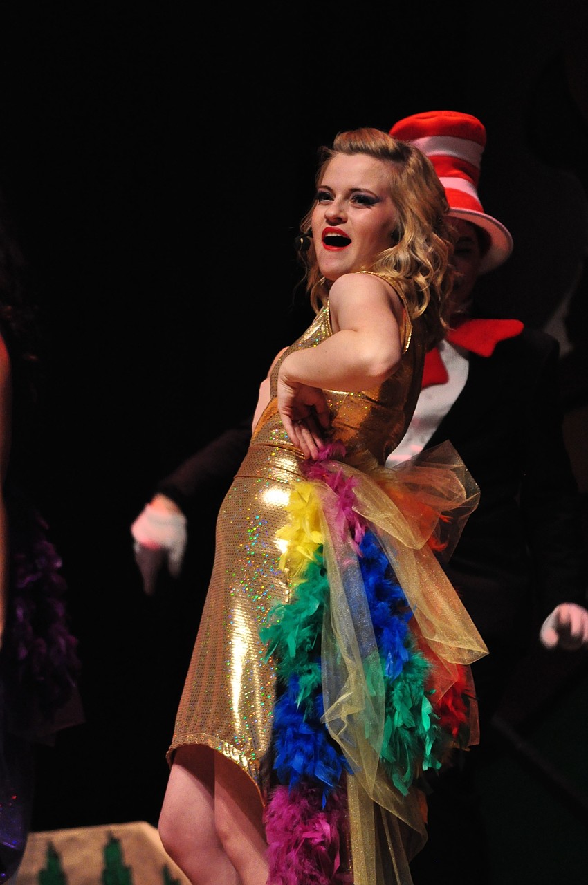 Libby Oliver, as Mayzie La Bird, flaunts her tail feathers.