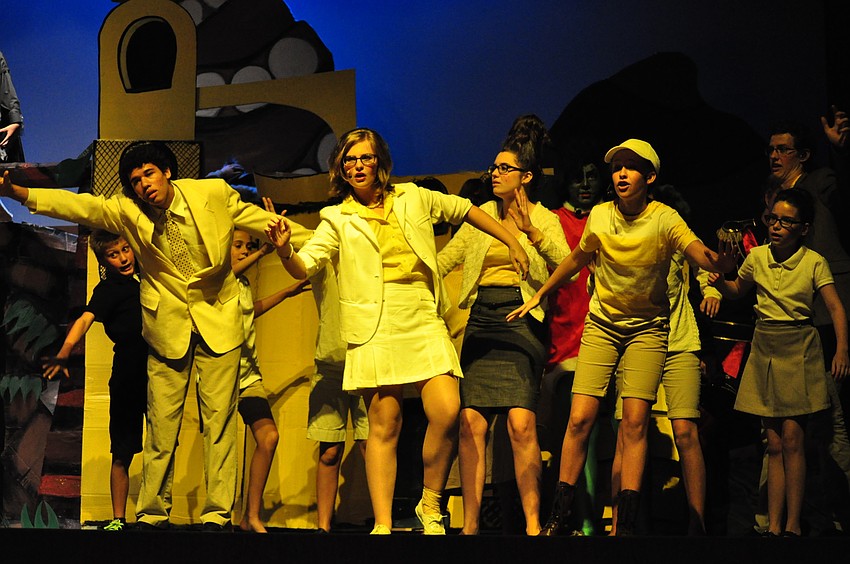 Whoville residents nearly fall as someone shakes the clover on which they live.