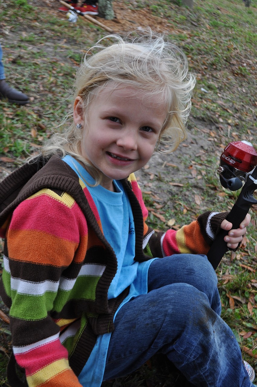 Lena Spencer, 6, fishes for the first time.