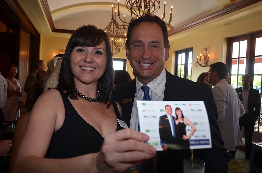 Melissa Perkins and Eric Peters take advantage of two photo opportunities.