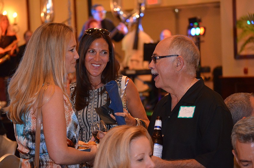 Cheri Christiansen and Leann Spofford chat with Jim Soda.