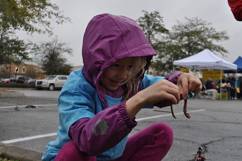 Vivian Heimgartner, 7, hooks her own worm.