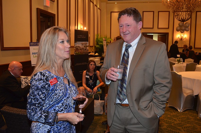 Amy McKenna and Anthony Hueston share stories and laughs before dinner.