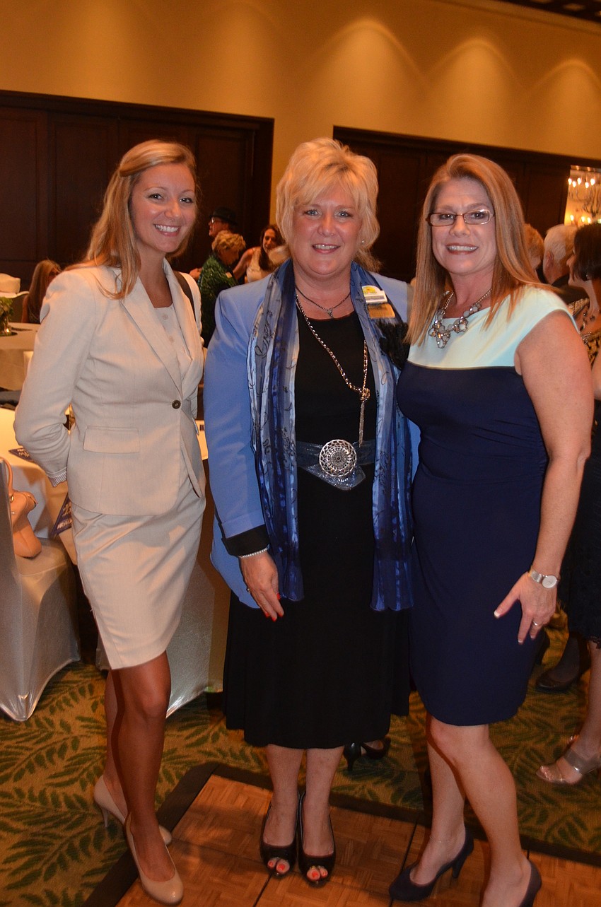 Kyanne Merrill, Maribeth Phillips and Angie Kaleskas show off their dresses and smiles.