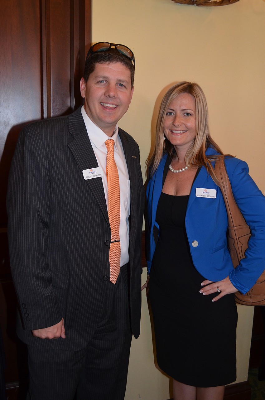 Co-workers Greg Poznanski and Elizabeth Stephen are among 200 event attendees.
