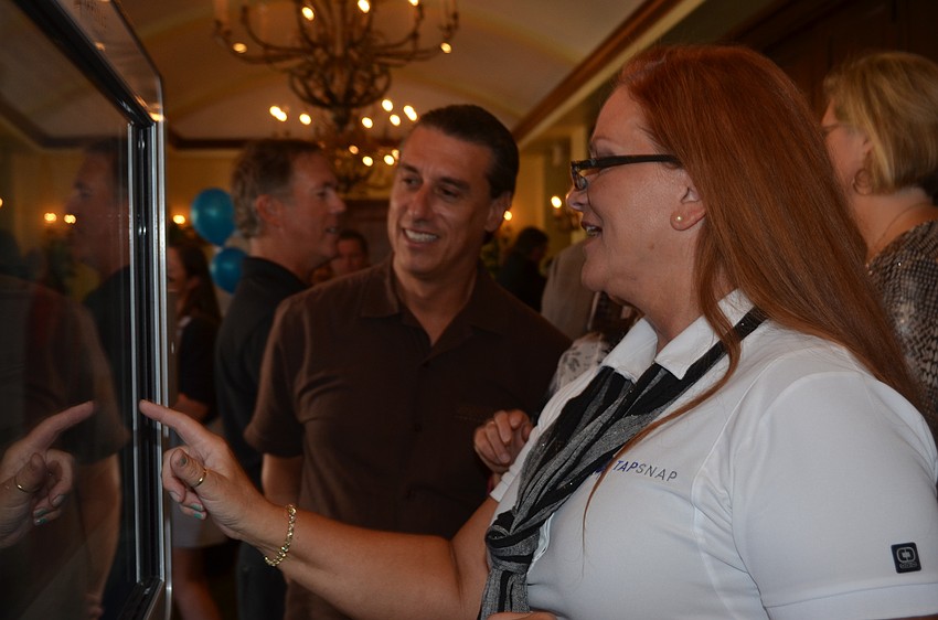 Blenda Vines edits a photo for Adam Miller.