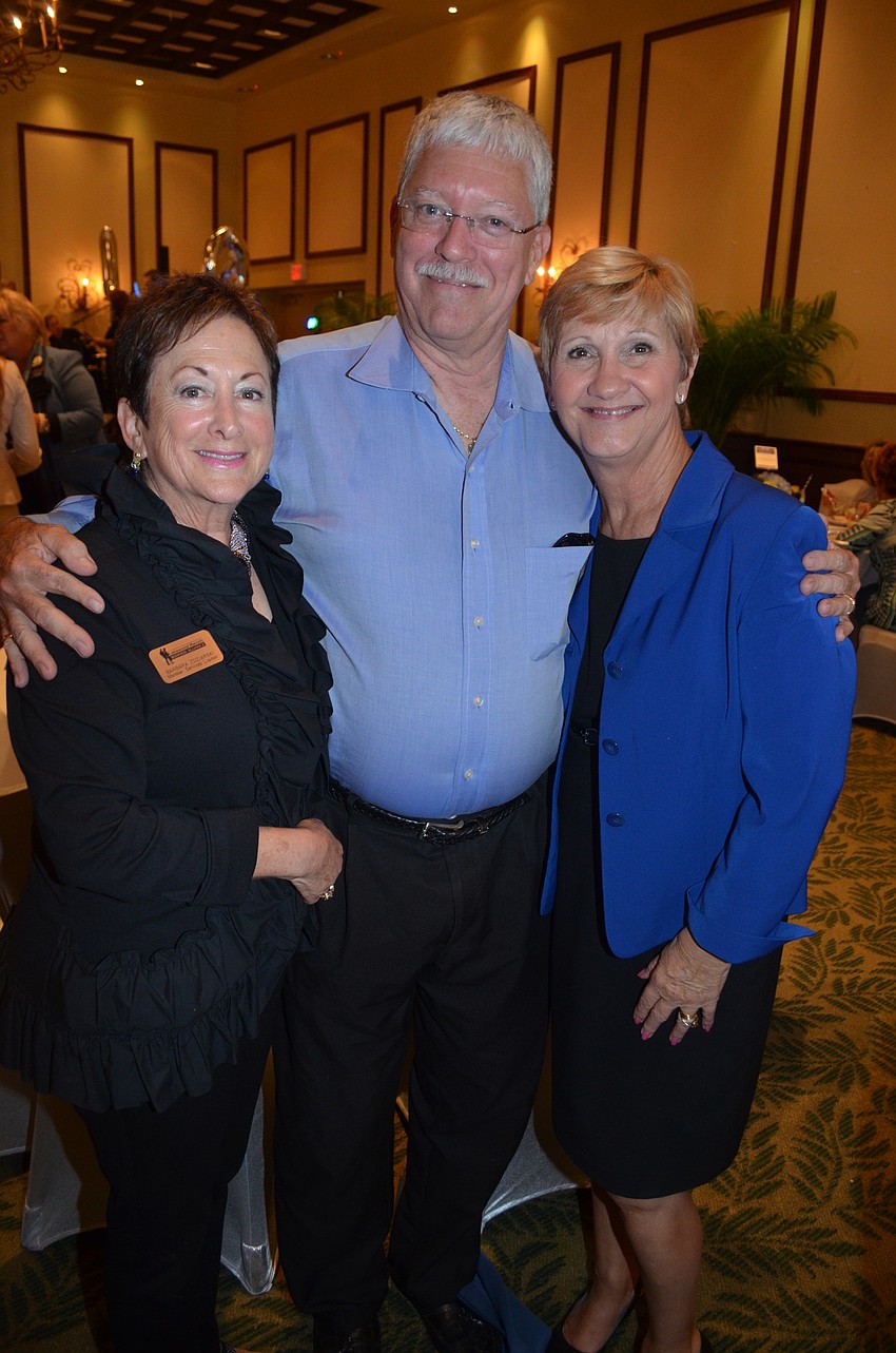 Don Baugh poses, flanked by Barbara Zdziarski, of the alliance, and his wife and District 5 Commissioner Vanessa Baugh.
