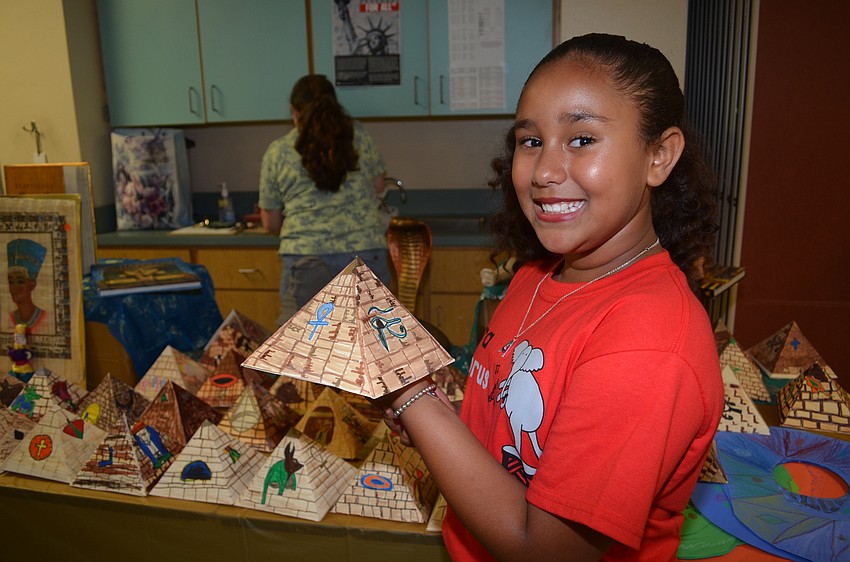 Amya Dunbar crafted a 3 D paper pyramid.