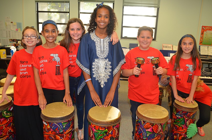 Maddison Hammond, Emily Giraldo, Emilee Gately, Alicia Arguez, Zach Mauer and Jalenairam Marga show off their instruments after their performance.