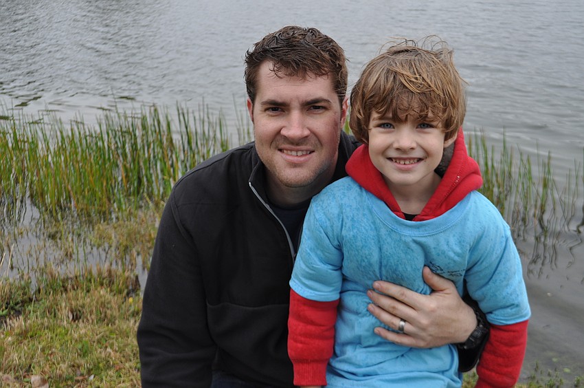 Dustin and Eli Myers stay warm.