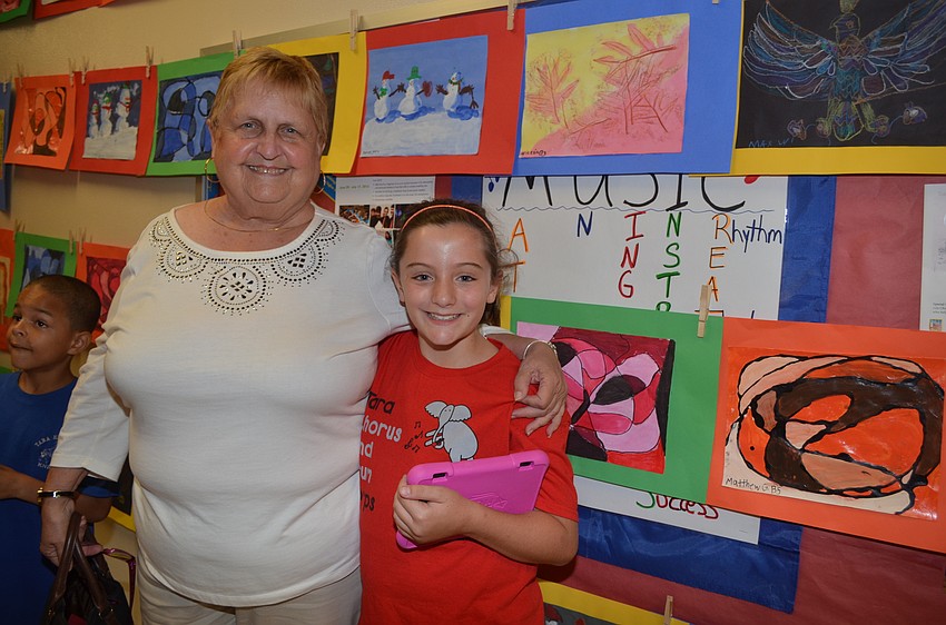 Tonya Spires enjoys looking at her granddaughter Kaylee Gulbrandsen's paintings.