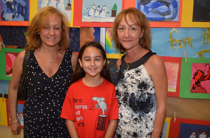 Katia Singh poses flanked by her aunt, Denise Williams, and mother, Desiree Frain.