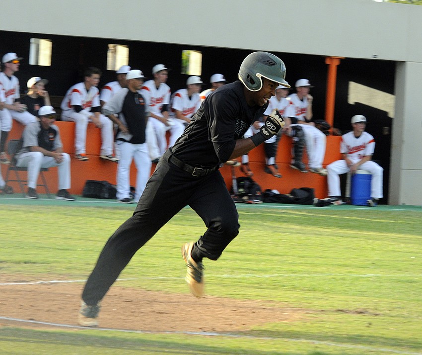 Shortstop Cameron Pearcey races down the first base line after getting a hit in his first at bat.