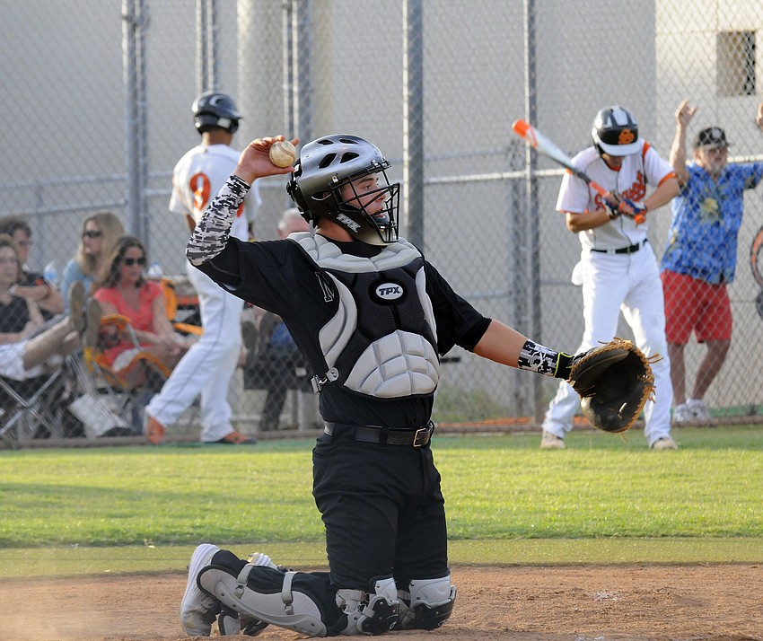 Catcher Matt Roberts warms up in between innings during the Class 7A-Region 3 semifinals May 5.