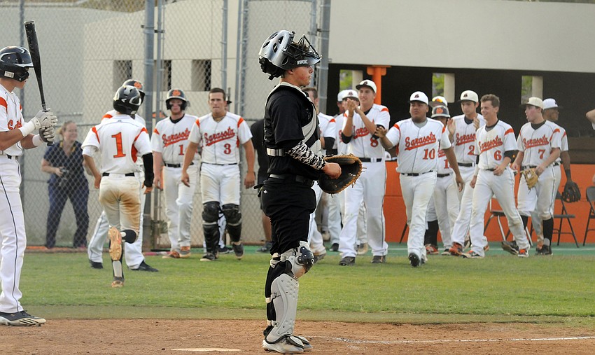 Lakewood Ranch catcher Matt Roberts reacts after Sarasota scores a run in the second inning.