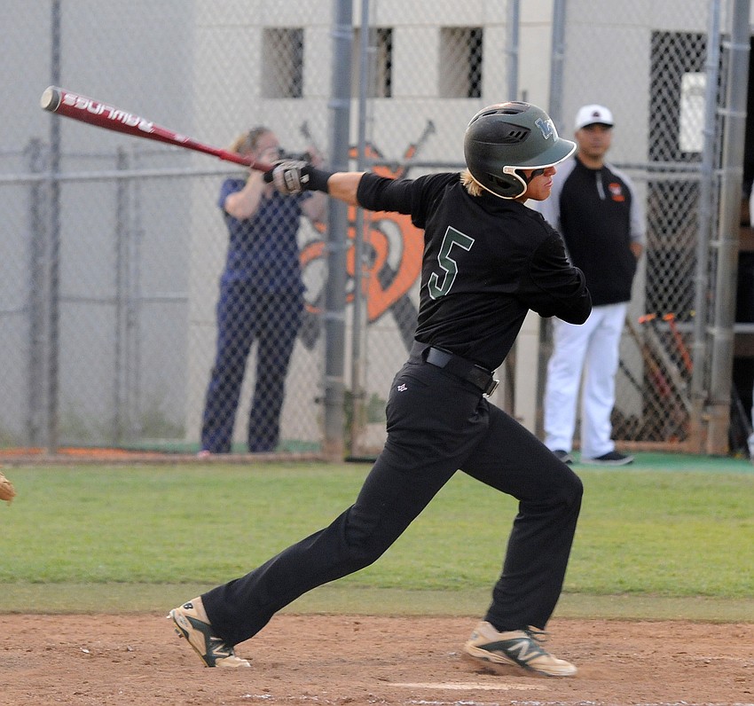 Lakewood Ranch’s Brendan Lewellen makes contact in the third inning.
