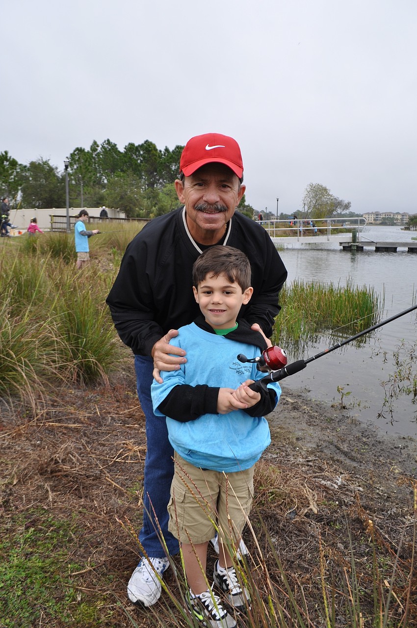 Tyler Schwab, 6, fishes with his grandfather, Jack Schwab.
