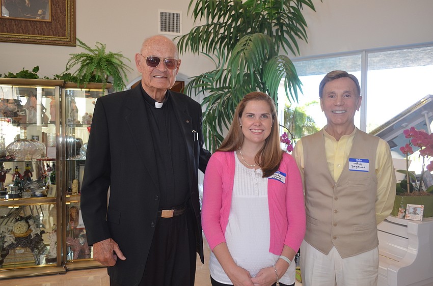 The Rev. Edward Pick, St. Martha principal Siobhan Young and donator Louis Zazarino