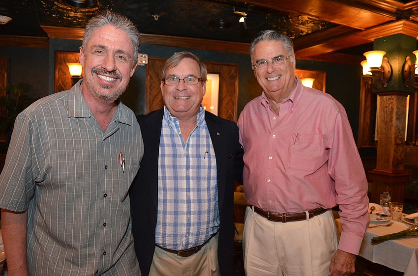 Michael Garey, Richard Crawford and Longboat Key Kiwanis Club President Armando Linde