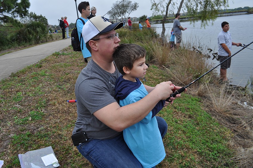 Alex Lopez helps his son, J.J., cast.