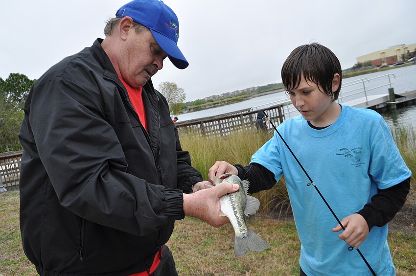 Event ranger Joe Kaminsky measures Jack White’s bass.