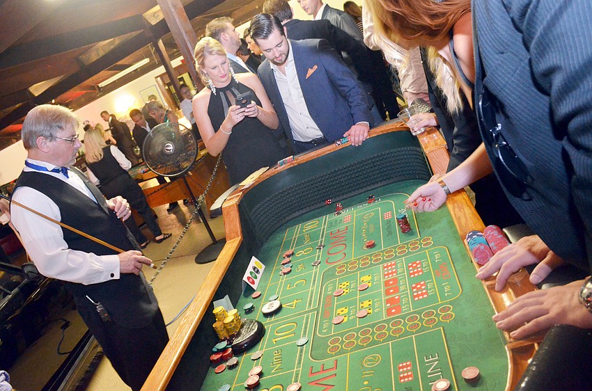 Guests played casino games at the Designing Daughters Fashionable Gala ‘Mystery Men and Bond Girls.’