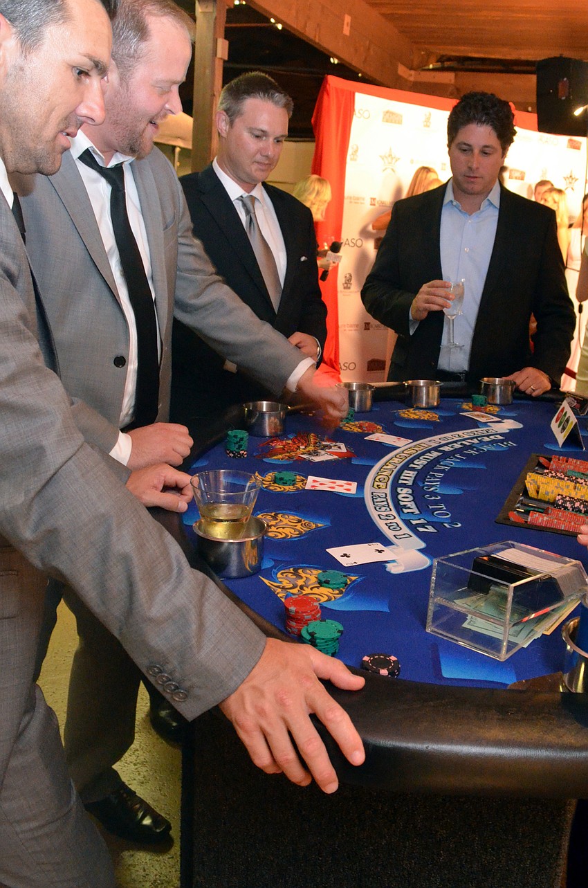 Guests played casino games at the Designing Daughters Fashionable Gala ‘Mystery Men and Bond Girls.’