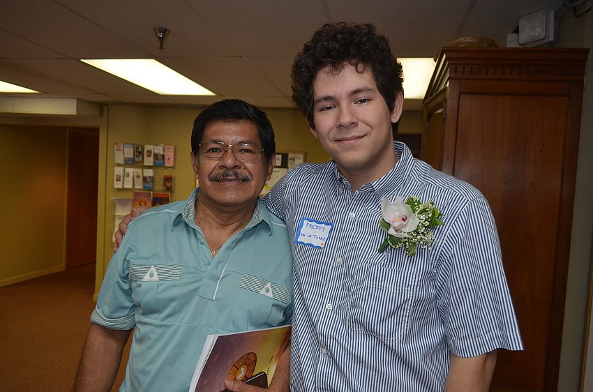 Scholarship recipient Freddy De La Torre with his father, Freddy