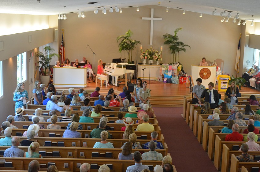 The scholarship recipients stand up as they are recognized.