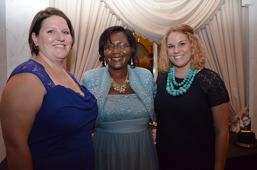 Julie Ott, Booker High School Principal Rachel Shelley and Alyssa Bolen