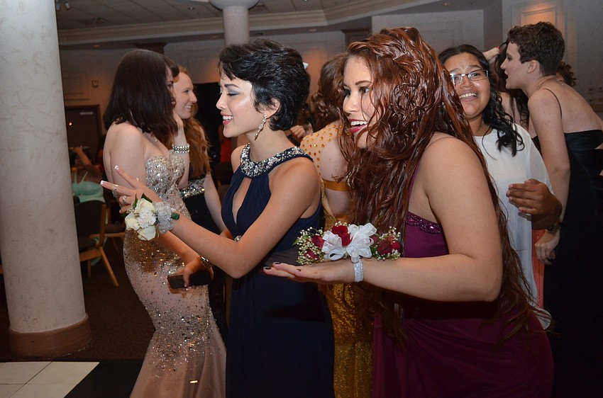 Rachel Ross and Ana Martinez have fun on the dance floor.