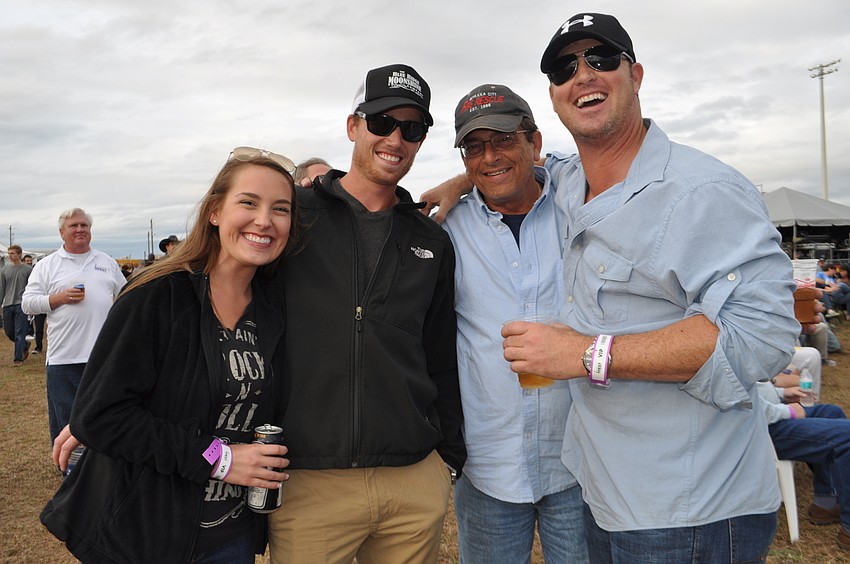Lauren Routh poses with Cote Hone, Larry Routh and Ryan Routh.
