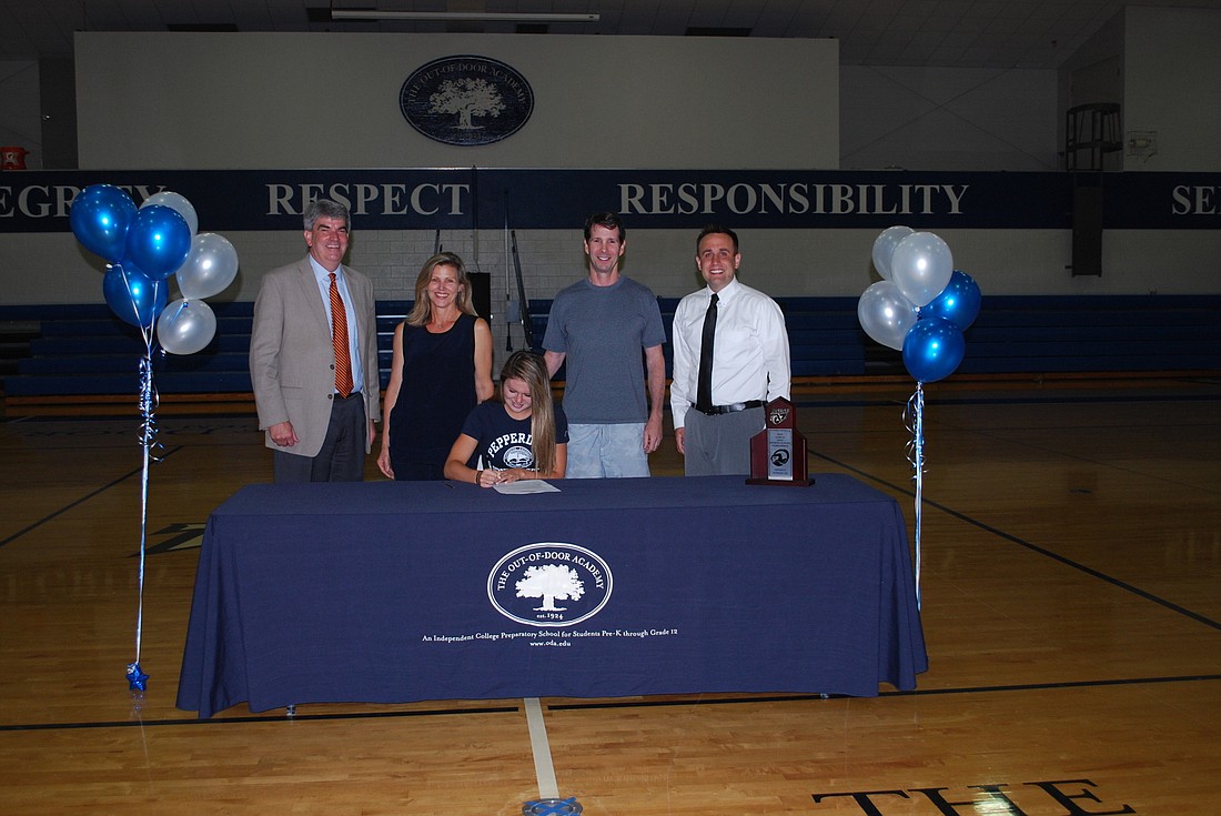The Out-of-Door Academyâ€™s Joie Eckhard will swim for Pepperdine University in the fall after signing a national letter of intent in front of family and friends April 27. Courtesy photo