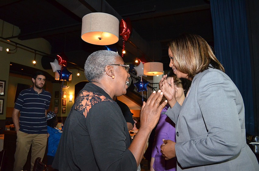Sarasota County Commissioner Carolyn Mason congratulates Shelli Eddie on the win.