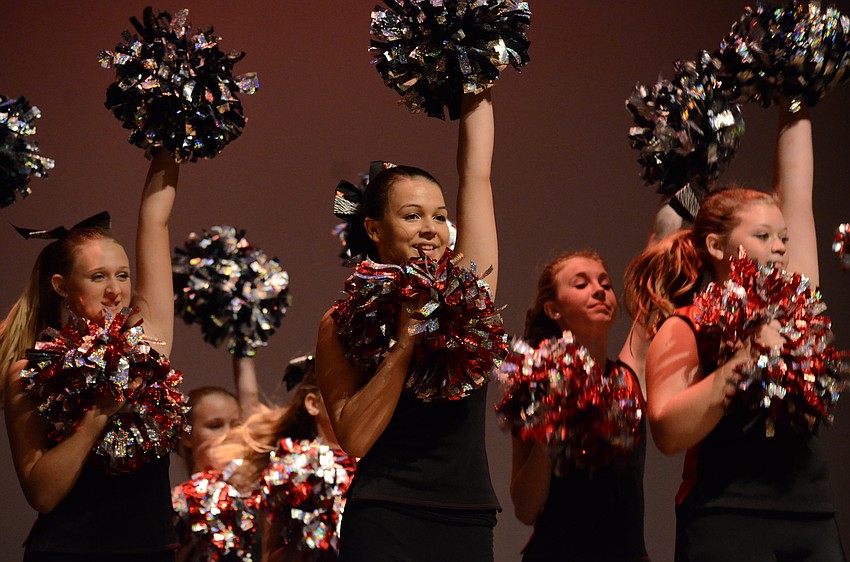 Olivia Andrews, Emily Byrd and Samantha Torino, Braden River Middle School dancers, perform a pompom routine to Problem.