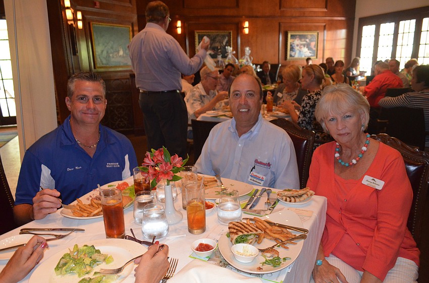 Drew Moon, of Freedom Boat Club, Al Benincasa, of Conditioned Air, and Peg Pluto, of Tommy Bahama