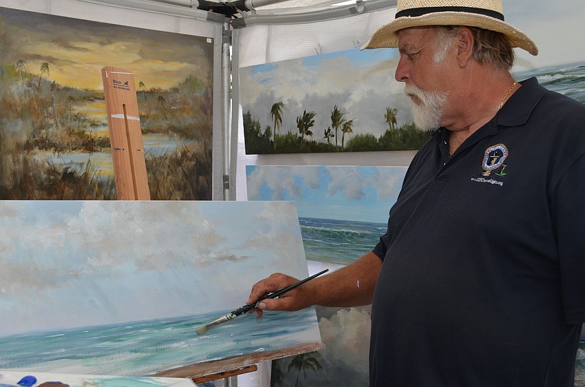 Gary Odmark works on a scene of the gulf during the Sarasota Rotary Art Festival.