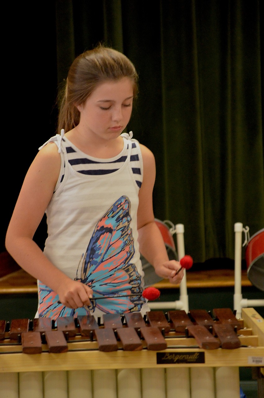Ava George focuses on her instrument during one of two performances that day.