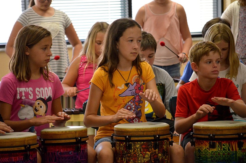 Jorja Heine, Antonia Boyd and Aidan Hebert team up on the drums.