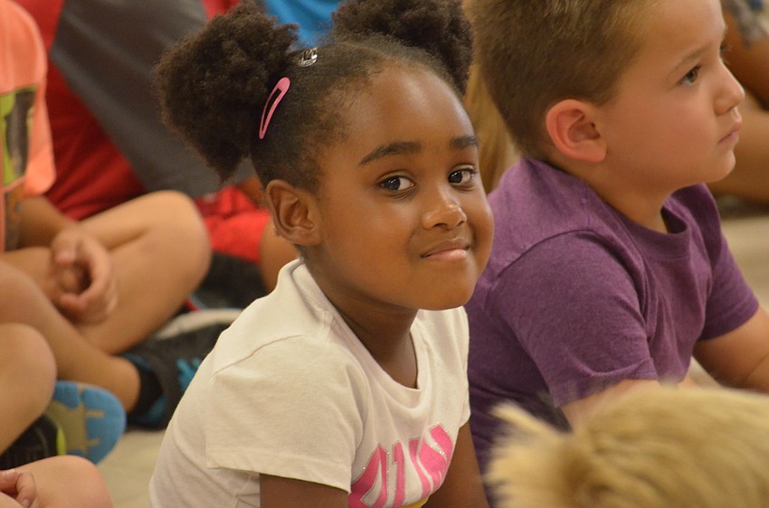 Kindergarten student Starlla Jackson enjoys the big kids' performances.