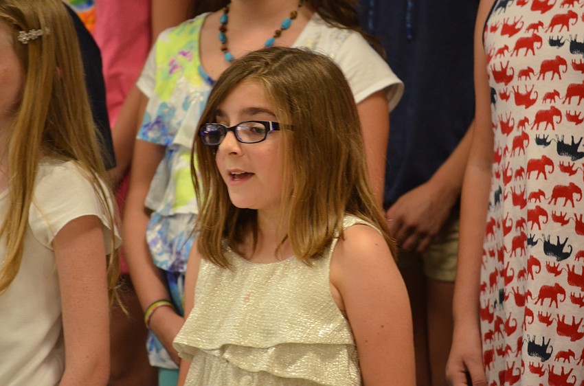 Avery Powell sings soprano melodies throughout the performance.