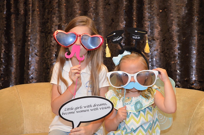 Kendall Campion and Elle Miller dress up for the photo booth.