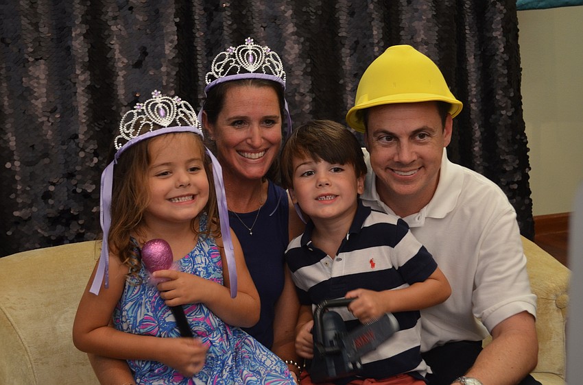 Lydia, Ryan, Charlotte and Spencer Chapdelain pose together for the photo booth.
