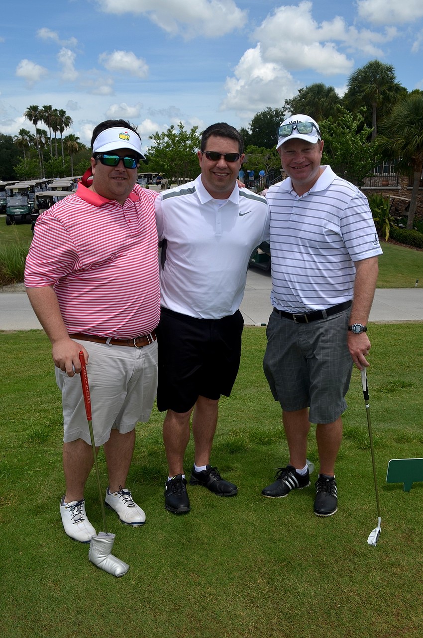 Friends Chris Chaney, Travis Hutson and Trevor Mask enjoy time with friends before the tournament starts.