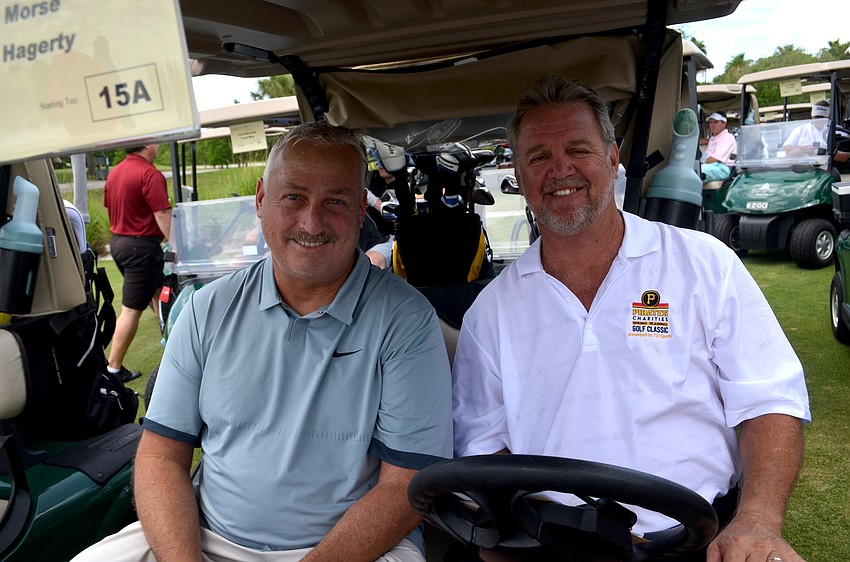 Pat Hagerty and Jeff Marx wait for the signal to drive toward hole No. 1.