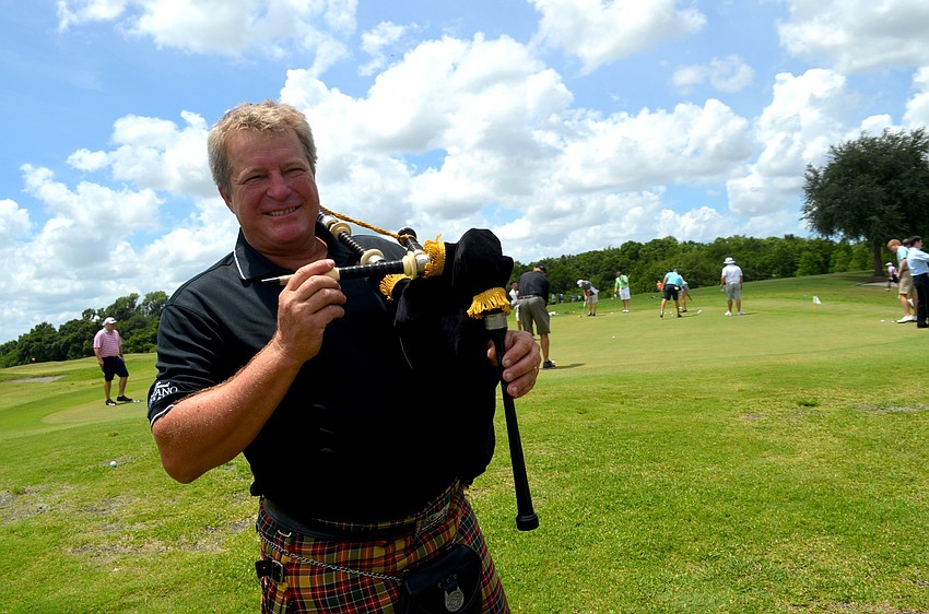 Gary Reinstrom plays the bagpipe for attendees.