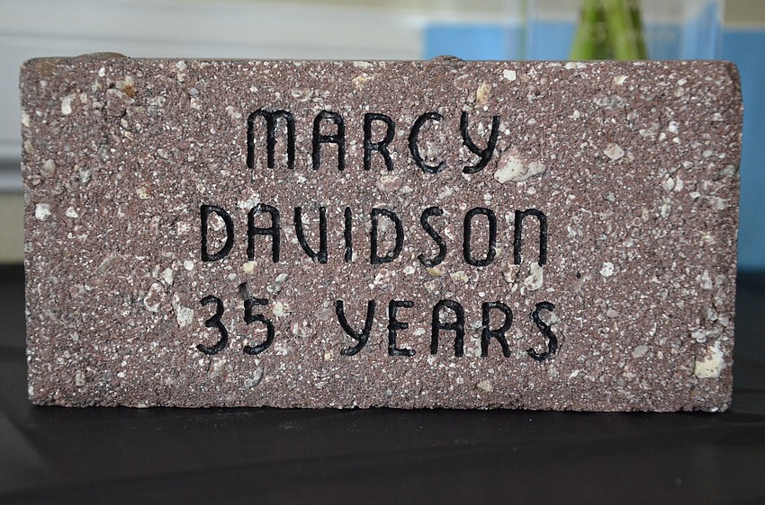 Marcy Davidson received a brick with her name, which will be placed in a walkway at the school.