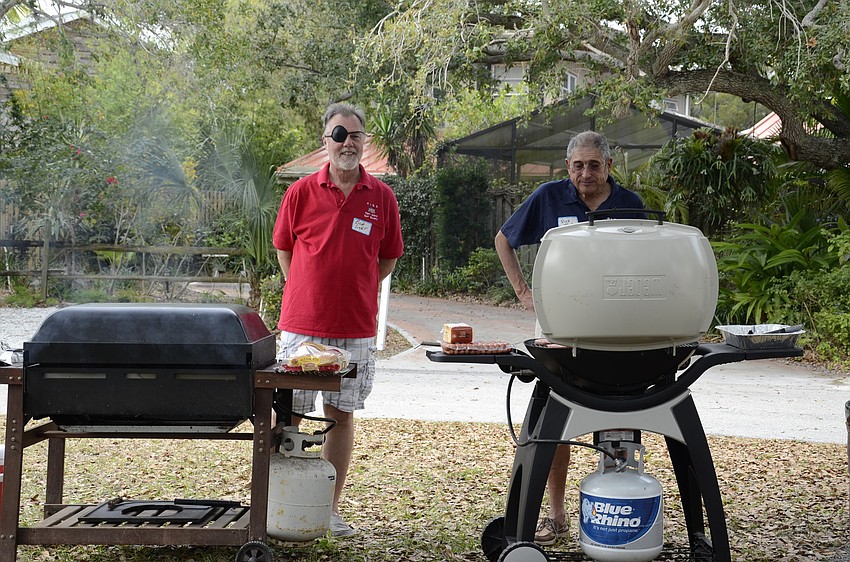 Some neighbors brought their grills to make hamburgers and hotdogs.